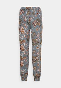 Hupparimalliset collegehousut, joissa on kukkakuosi hillityssä siniharmaassa kankaassa. Varustettu joustavalla vyötäröllä, jossa on nyöri, sekä ribbaresitimilla.