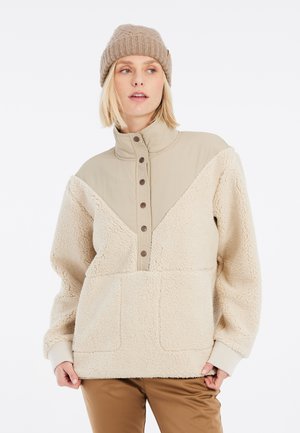 Fleece pullover in crème met een tan-kleurige kraag en knoopsluiting. Voorzien van een kangaroo pocket en een gestructureerde stof voor warmte.