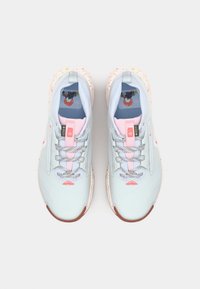 Light blue athletic shoes with pink accents, speckled sole, lace-up design, and breathable mesh upper featuring a pattern inside.