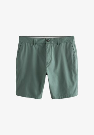 Pantalones cortos de algodón verdes con cierre de botón, dos bolsillos laterales, parte delantera plana y una textura suave. Cuenta con una cinturilla con forro en contraste.