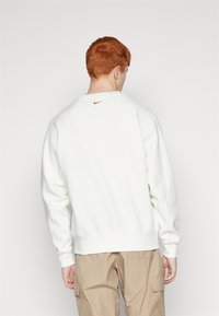 Nike Sportswear Mikina s kapucí - off-white