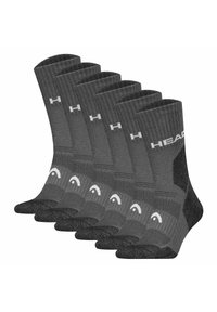Cinque paia di calzini grigi con trama a coste, talloni rinforzati e dettagli del logo bianchi, disponibili in una lunghezza standard fino a metà polpaccio.