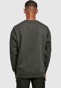 Merchcode THINK DIFFERENT - Sweatshirt - charcoal