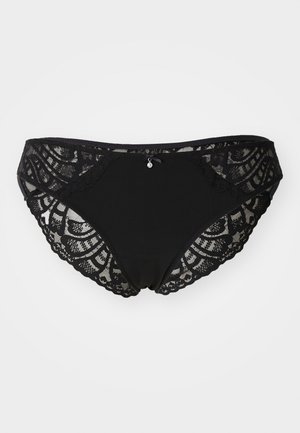 Black lace underwear featuring a scalloped edge, sheer lace panels, and a small decorative charm at the center front. Soft fabric base.