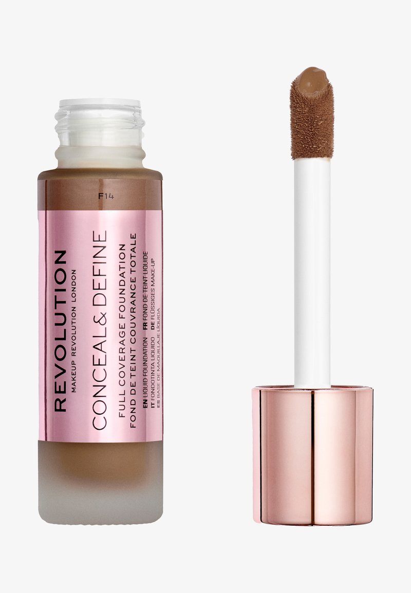 Liquid foundation in a clear glass bottle with a pink label, topped with a white applicator wand. Rich tan-brown shade.