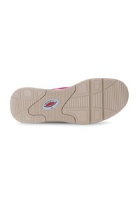 Shoe sole with a textured beige rubber surface. Features a circular logo and a patterned grip design with deep grooves and raised accents.