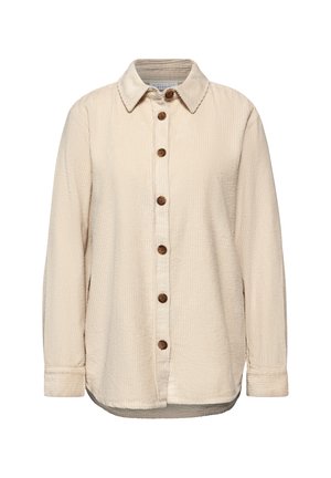Chemise en velours côtelé beige avec un col pointu, fermeture à boutons sur le devant et manches longues. Ourlet arrondi et texture ribbed sur l'ensemble.