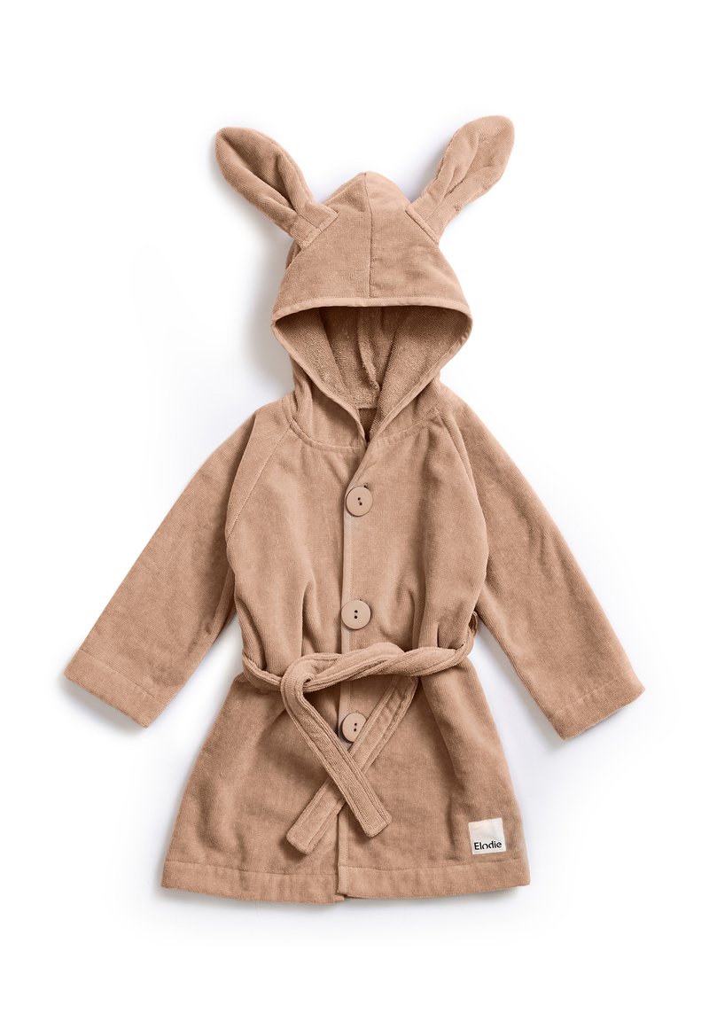 Barnroge i mjuk beige tyg med en huva som har kaninöron, framknappar och knytmidja. Inkluderar en liten märkesetikett.