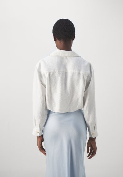 sandro CHEMISE YEKPA PRESSIONS - Blúzka so zapínaním na gombíky - blanc