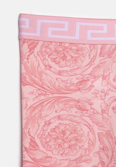 Pink fabric featuring intricate floral and leaf patterns with a textured finish. The waistband is light pink with a geometric design.