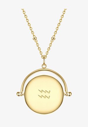 Arany nyaklánc, kerek medállal, ívelt tetejével, cikkcakk mintával gravírozva, finom láncon.