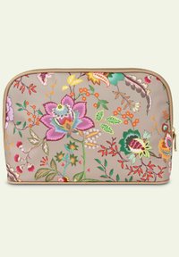 Cosmetica tas met bloemenprint, met een beige achtergrond en kleurrijke bloemen en bladeren, gouden rits en afgeronde hoeken. Afmetingen zijn ongeveer 9x6 inch.