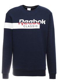 Mörkblå sweatshirt gjord av bomull med långa ärmar, prydlig med en stor vit och röd "Reebok Classic"-logotyp över bröstet.