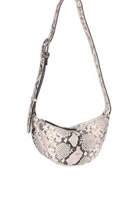 Snakeskin-patterned shoulder bag in black and white, featuring a curved shape, adjustable strap, and zip closure. Smooth, textured surface.