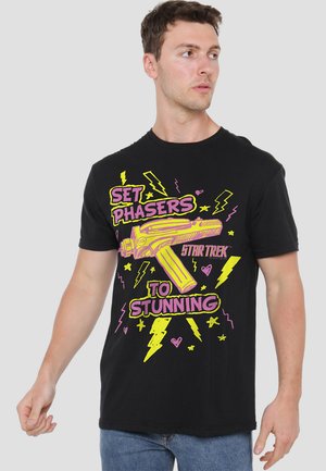Black cotton t-shirt featuring a graphic design of a phaser, with neon yellow and pink text and lightning bolt accents.