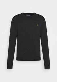 Felpa nera in cotone con scollo rotondo. Presenta maniche lunghe, polsini a coste e un piccolo logo dorato sul petto.