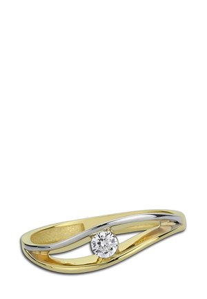 Anneau en or et argent avec un design ondulé et un diamant rond central. Surfaces lisses avec textures polies et contraste bicolore.