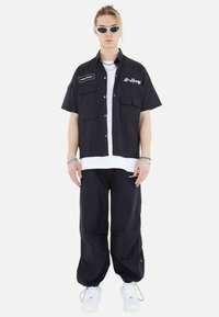 Megaman FREIZEI SET - Trousers - schwarz