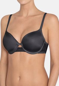 Sujetador negro acolchado con acabado liso, tirantes ajustables y una banda decorativa de encaje. Detalle central de lazo que añade un acento sutil.