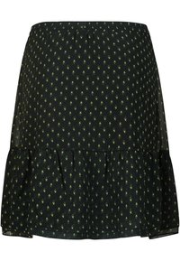 Jupe noire avec des motifs en forme de goutte verte, fabriquée en tissu léger. Présente un ourlet à volants et une taille élastique.