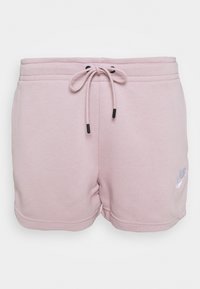 Vaaleanpunaiset shortsit, pehmeästä kankaasta, joissa on joustava vyötärönauha ja musta kiristysnauha sekä pieni valkoinen Nike-logo sivussa.