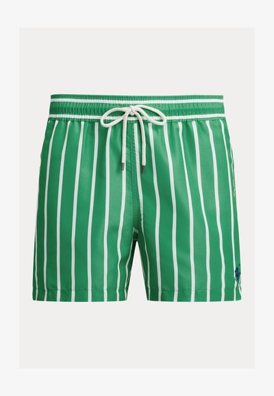 Πράσινο μαγιό με λευκές κάθετες ρίγες και λευκό κορδόνι στη λαστιχένια μέση, με μικρό ναυτικό λογότυπο στο πόδι.