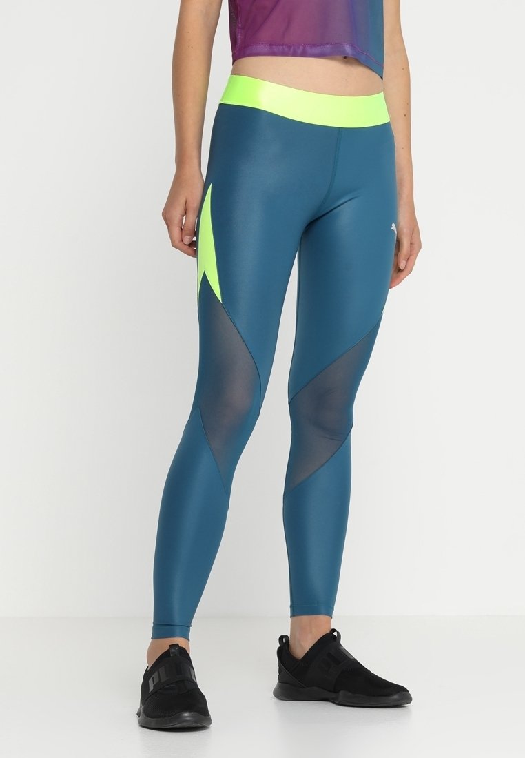 Leggings en color verde azulado con una cinturilla amarilla alta, que presentan paneles de malla y acentos en neón angulares, diseñados para ropa atlética.