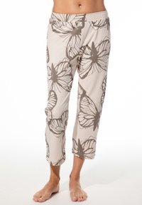 Hellbeige, gekürzte Hosen mit einem Schmetterlingsmuster in Braun, ausgestattet mit einem elastischen Bund und einer weichen Stofftextur.