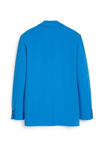 Blå blazer med en mjuk textur, strukturerade axlar, slitskragen och knäppta ärmmuddar, med en ren bak utan dekorationer.