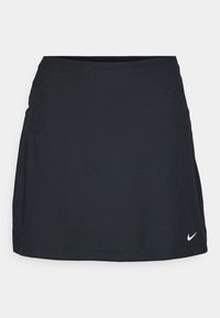 Černá atletická sukně s texturovanou tkaninou, přiléhavým pasem a malým bílým logem na přední straně. Jednoduchý a funkční design.