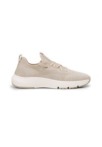 Beige neulottu tennarit, joissa on litteät nauhat, pehmustettu pohja ja teksturoitu päällinen. Takana on silmukka, joka helpottaa pukemista.