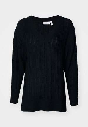 Black knitted sweater with a V-neck, ribbed texture, and long sleeves. Loose fit with a slightly longer back. Brand label visible.