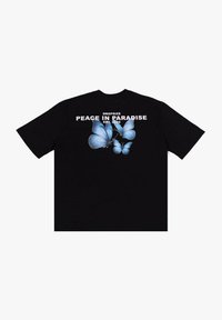 Black t-shirt featuring blue butterfly graphics on the back, with white text reading "DROP SIZE PEACE IN PARADISE EST. 2020."