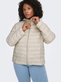Light beige puffer jacket with a zip front and adjustable hoodie, featuring quilted texture and side pockets. Worn over blue jeans.