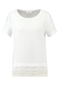 Top blanco de manga corta con cuello redondo, dobladillo en capas, textura suave y puños doblados. Hecho de una tela ligera.