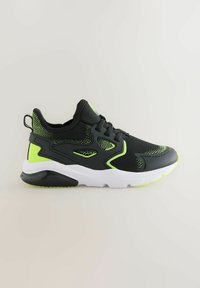 Black athletic shoe with mesh upper, neon green accents, sturdy sole, and textured detailing. Features a pull tab on the heel and laces.