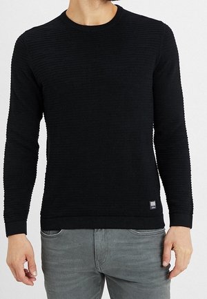 Zwarte pullover trui met textuur en horizontale strepen, ronde halslijn en geribbelde manchetten. Heeft een klein label aan de onderkant.