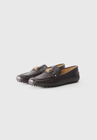 Brown leather loafers with a rounded toe, decorative strap, and gold hardware accents. Textured sole for grip.