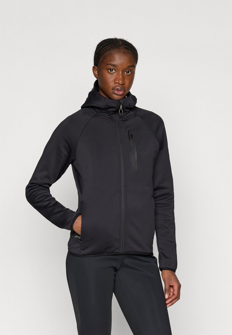 Mustavärinen vetoketjullinen takki, jossa on korkeakauluksinen malli, raglan-hihat, sivutaskut ja tyylikäs viimeistely. Sileä rakenne, kevyt suunnittelu.