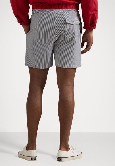 Men's striped shorts in navy and white, featuring a relaxed fit, back pockets, and a textured cotton blend. Accented with a small tag.