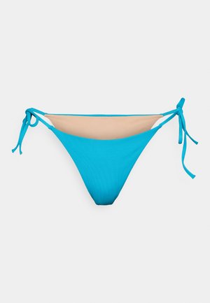 Mėlynas bikini dugnas su lygiu audiniu, turi reguliuojamus raiščius šonuose ir kontrastingą beige panelę priekyje.