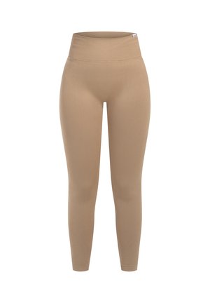 Beige hochtaillierte Leggings aus dehnbarem Stoff, mit einer glatten Textur und körperbetontem Design, das sich am Knöchel verjüngt.