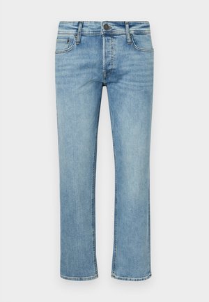 Lyseblå denim jeans med rette ben, fem lommer og knappestenging. Har subtil slitasje og falming over hele.