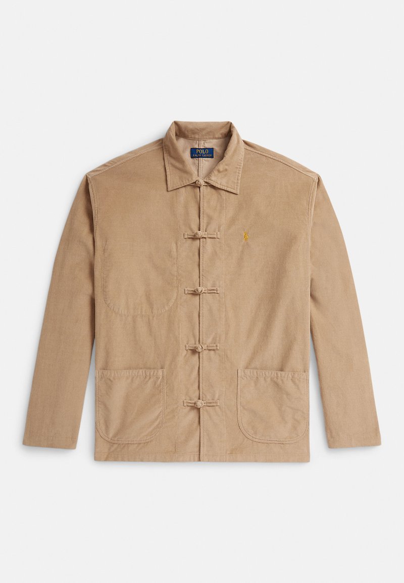 Beige Cordjacke aus Cord mit Kragen, vier Froschverschlüssen, zwei unteren Taschen und einem kleinen gestickten Logo auf der linken Brust.