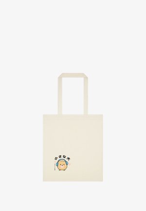 Sac fourre-tout en toile, couleur crème, avec des poignées à longueur d'épaule, présentant un chien en dessin animé avec des écouteurs et un texte japonais en bas.
