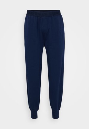 Navyblaue Baumwoll-Sweatpants mit einem taillierten Bund, der das eingeprägte Markenlogo trägt. Bündchen an den Knöcheln für ein tailliertes Design und lässige Passform.