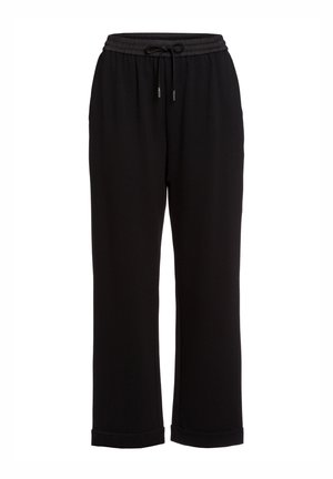 Schwarze Jogginghosen aus strukturiertem Stoff, mit einem elastischen Bund und Kordelzug, und gerippten Säumen für eine lockere Passform.