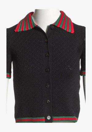 Cardigan nero testurizzato a maniche corte con bottoni frontali e colletto, polsini e orlo a righe rosse e verdi.
