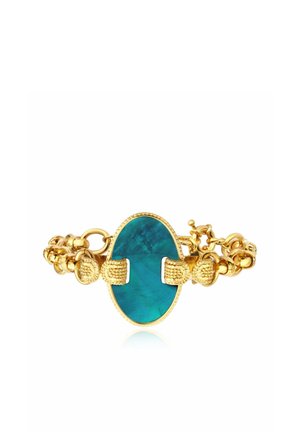 Bracelet en or avec un large centre en pierre ovale bleu sarcelle et fermoirs en or texturés sur une chaîne à maillons.