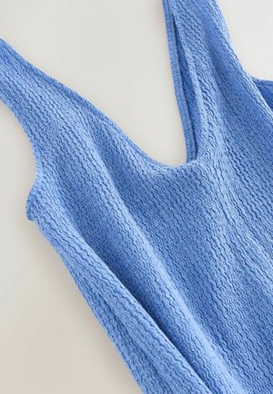 Blå tekstureret ærmeløs striktop med rund halsudskæring, vist fladt på en lys overflade.